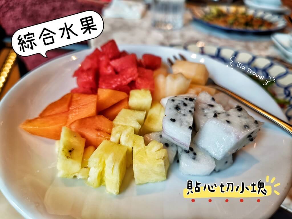 Fresh fruit platter thoughtfully cut into bite-size pieces, perfect for sharing.