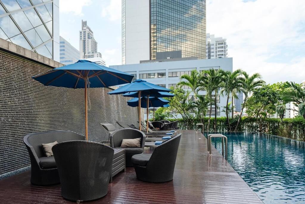 Chill spot with comfy loungers right by the Hilton Bangkok Grande Asoke's infinity pool.