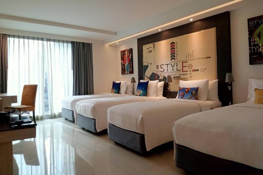 The quadruple room at Hotel Clover Asoke features four single beds, making it a perfect choice for a group of close friends traveling together.