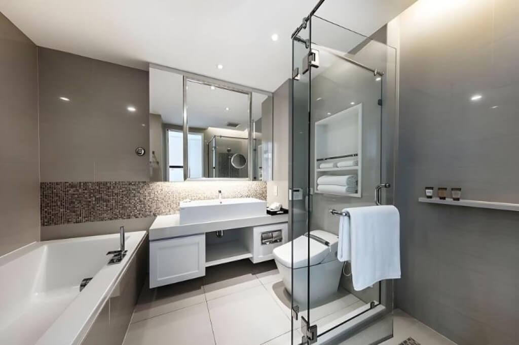 Grande Centre Point Terminal 21's bathroom is super spacious, with both a bathtub and a separate shower.
