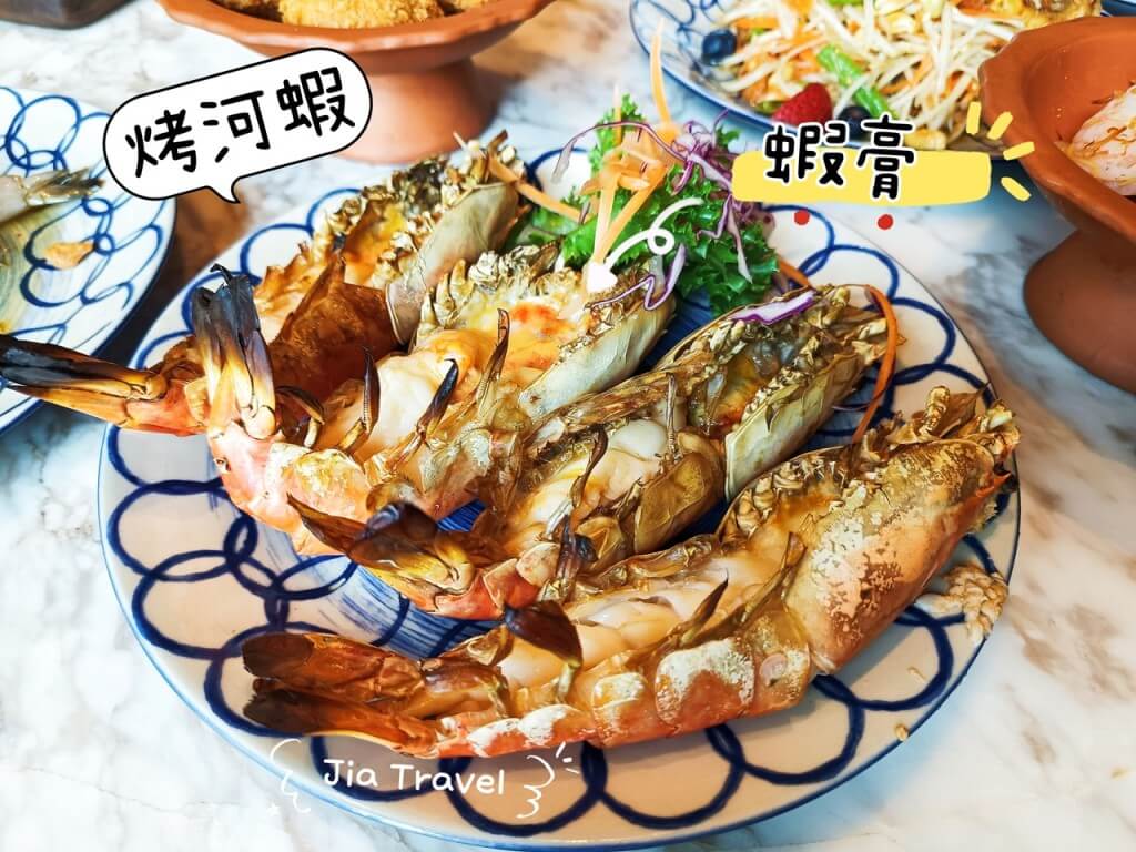 Close-up of grilled prawn head showing rich and flavorful paste inside.