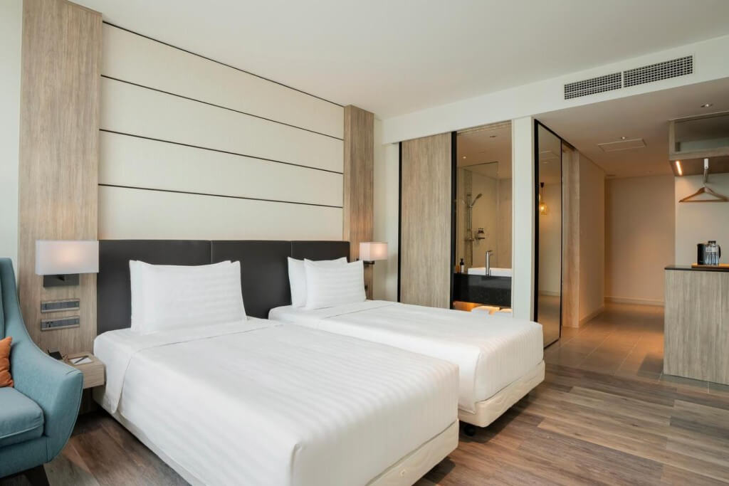 Solaria Nishitetsu Hotel's standard twin room - a chill spot with that clean, minimalist Japanese vibe and plenty of space to kick back.