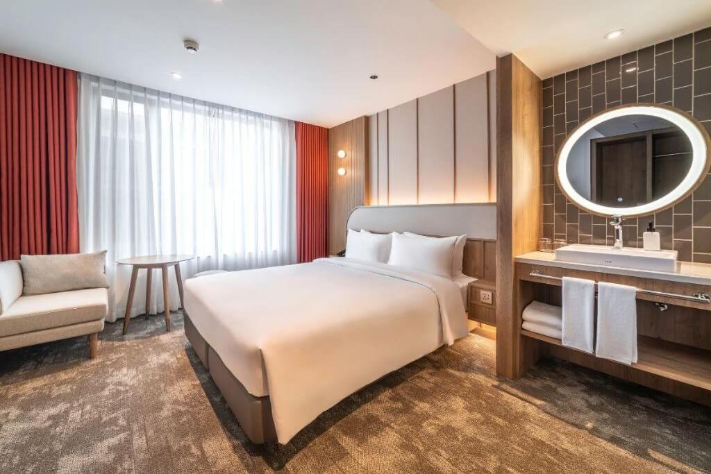 Comfortable Queen Size Bed in Deluxe Room at Sotetsu Grand Fresa