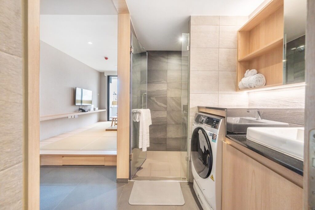 LiveZen Bangkok bathroom with washing machine and sink