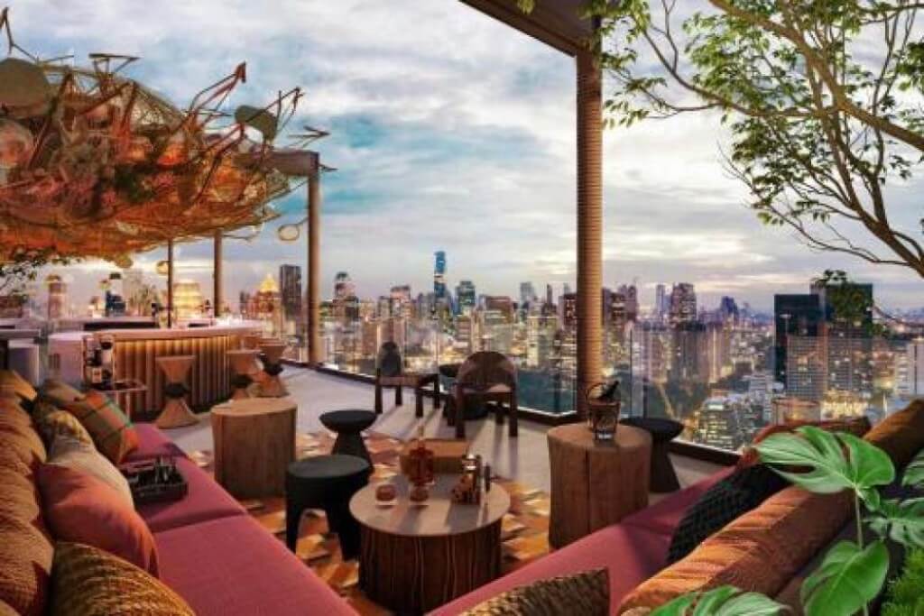 Moxy Bangkok Ratchaprasong rooftop bar sunset view with Bangkok skyline and city lights