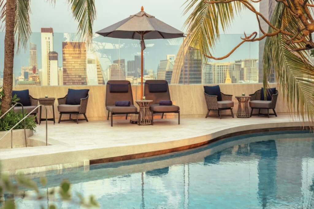 Intercontinental Bangkok pool lounge chairs with relaxing atmosphere and sun umbrellas