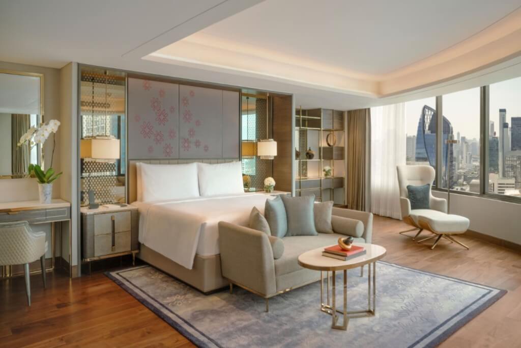 Intercontinental Bangkok king bed room with vanity table small sofa coffee table and open city view