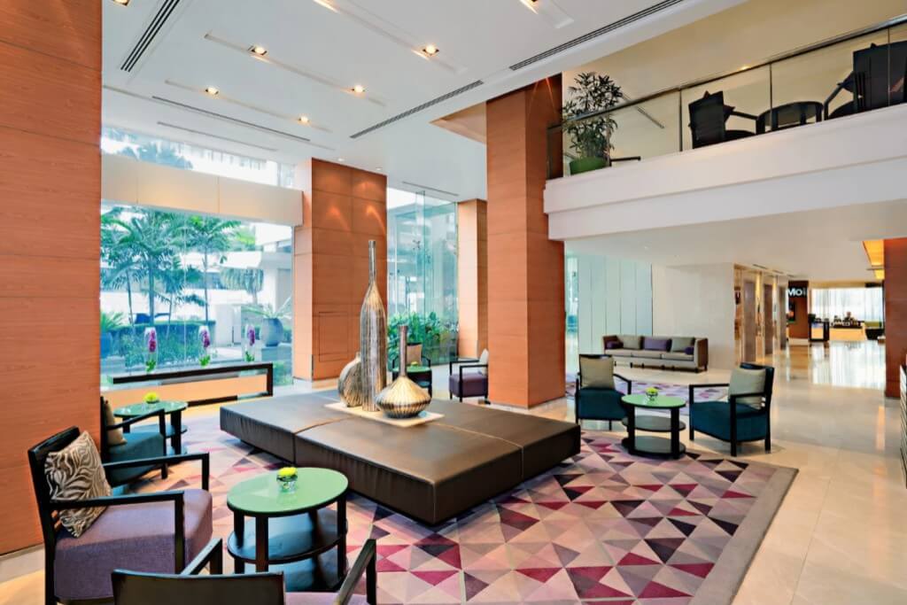 Courtyard Bangkok lobby lounge with high ceiling and floor-to-ceiling windows
