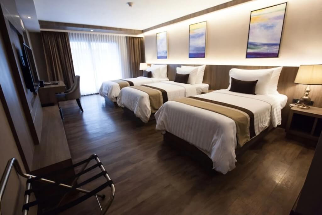 Arte Hotel Bangkok triple room interior with spacious layout