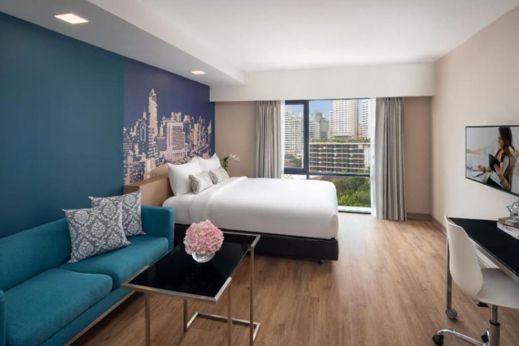 Check out the inside of a spacious studio at Citadines Sukhumvit 8 — comes with a chill living area and a small kitchen.