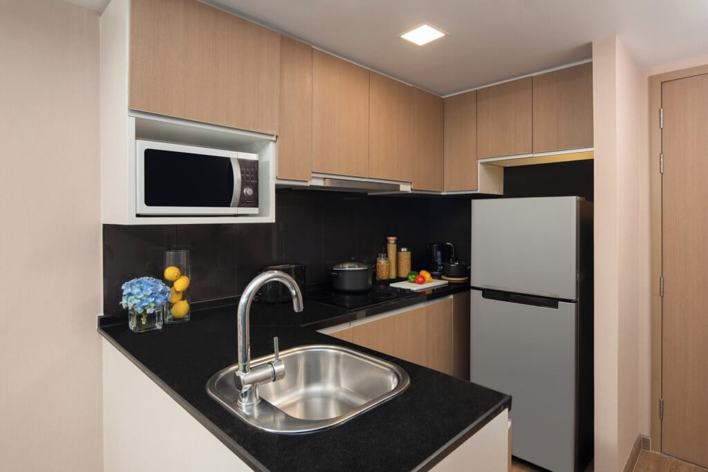 Citadines Sukhumvit 8 has a fully equipped kitchen in the room, complete with a stove and a fridge.