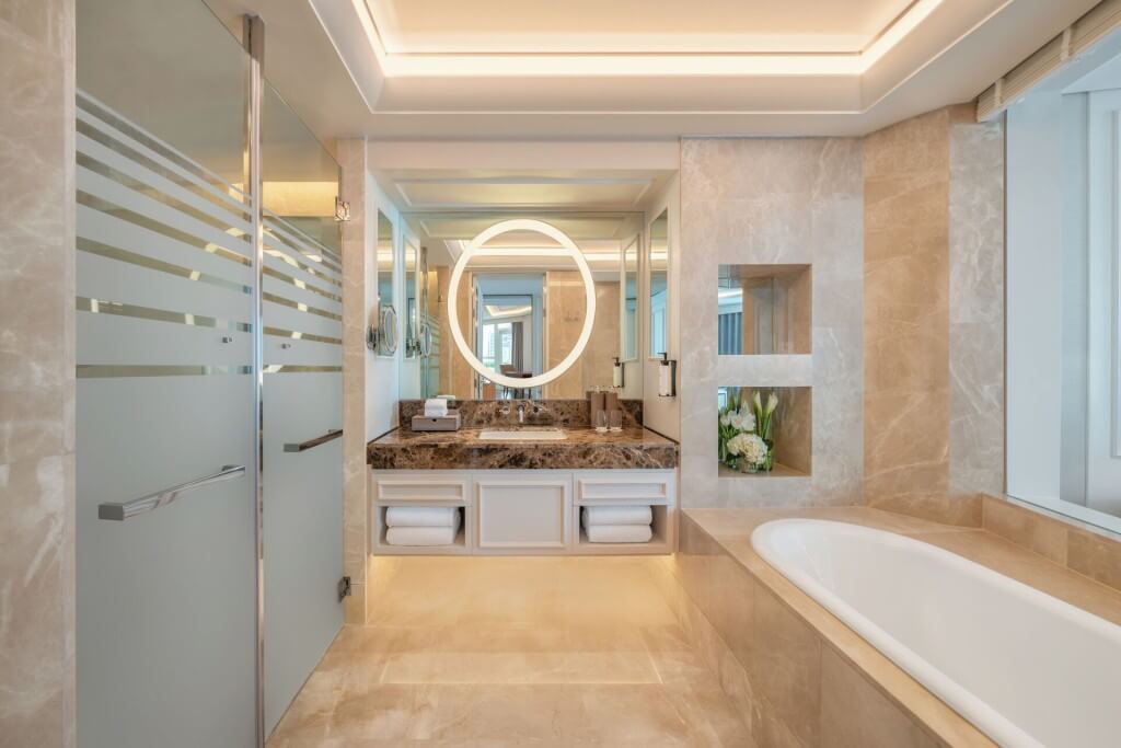 Sofitel Bangkok Sukhumvit bathroom with bathtub and separate shower