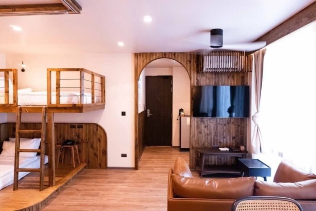 Our family room at Tints of Blue Hotel Bangkok comes with a little living room and a small kitchen.