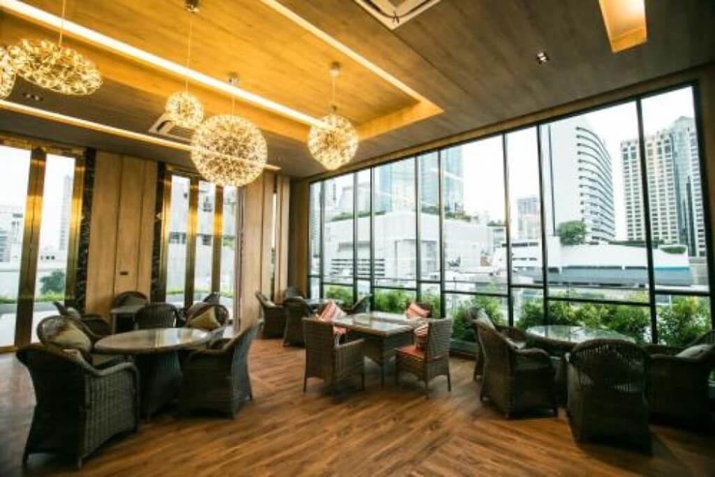 Arte Hotel Bangkok breakfast restaurant seating area with beautiful lighting