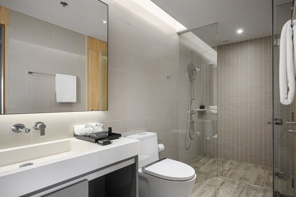 Oakwood Suites Bangkok bathroom with separate shower and toilet area