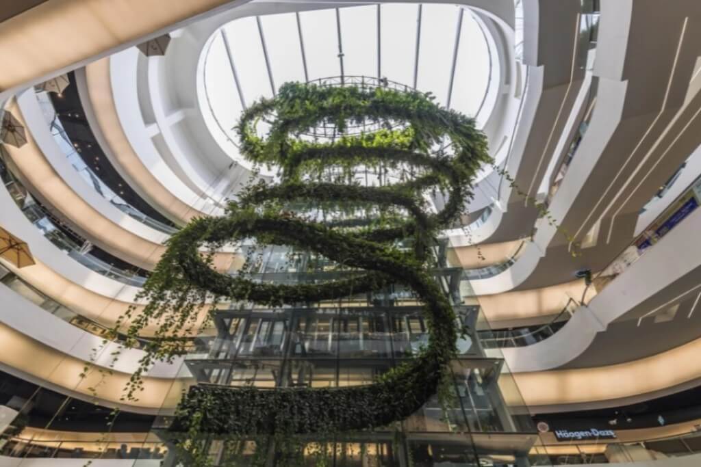 Maitria Hotel Sukhumvit 18 atrium with high ceiling and natural light from skylight