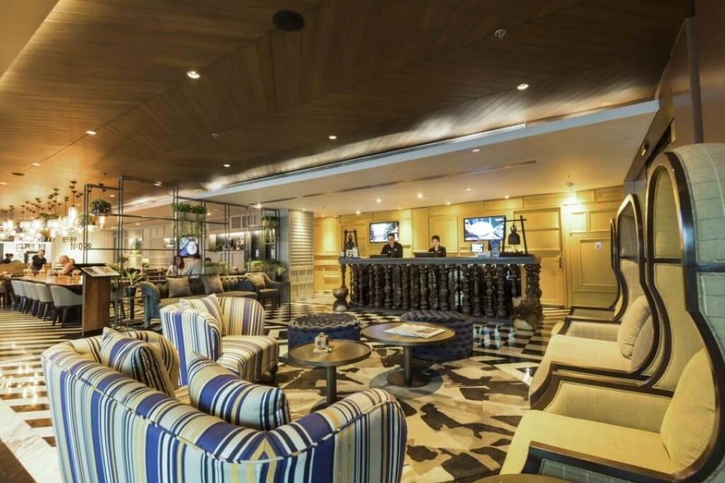 Maitria Hotel Sukhumvit 18 Bangkok lobby reception desk with friendly staff