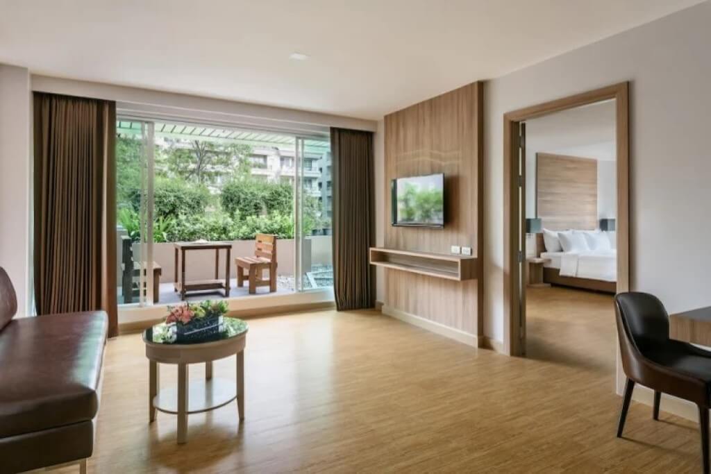 Living room in the One-Bedroom Suite at Oakwood Studios Sukhumvit Bangkok, a serviced apartment in Bangkok.