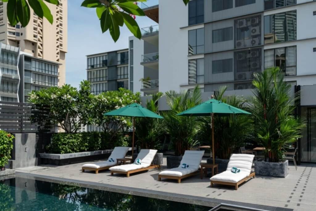 Maitria Hotel Sukhumvit 18 rooftop pool with comfortable sun loungers and relaxing atmosphere