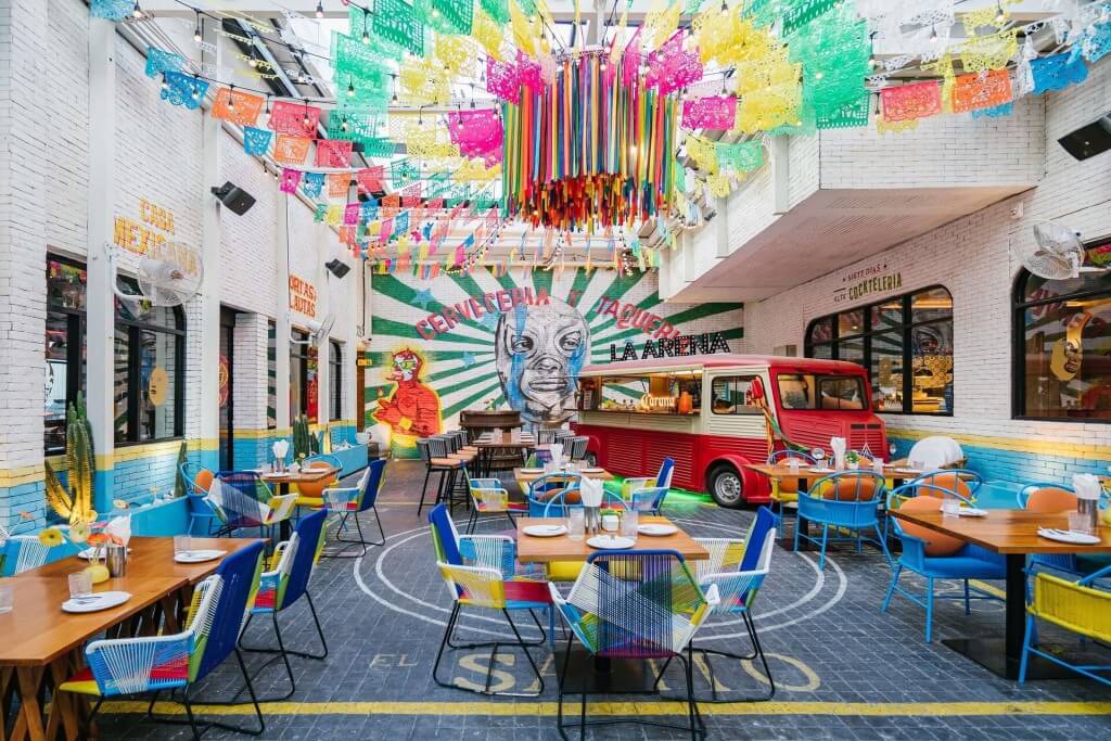 Vibrant and colorful restaurant seating area at Novotel Living Legacy