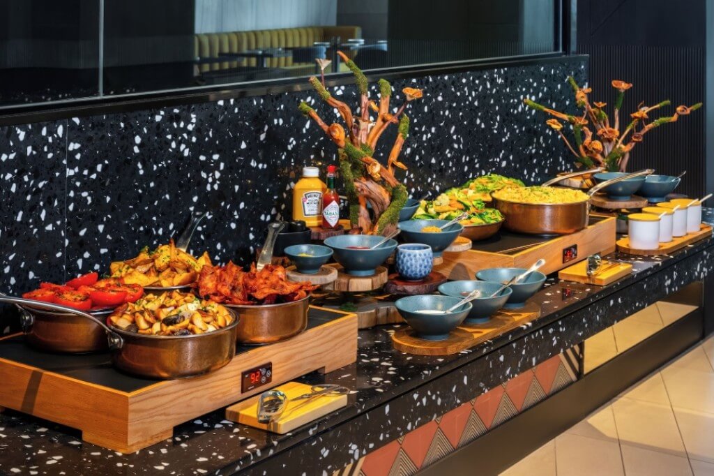 Tribe Living Bangkok Sukhumvit 39 breakfast buffet with variety of Western and Thai cuisine