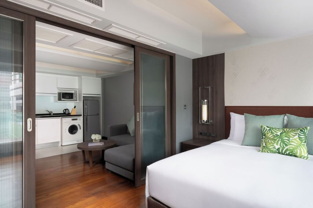 Spacious one-bedroom suite layout with separate living room at Novotel Living Legacy