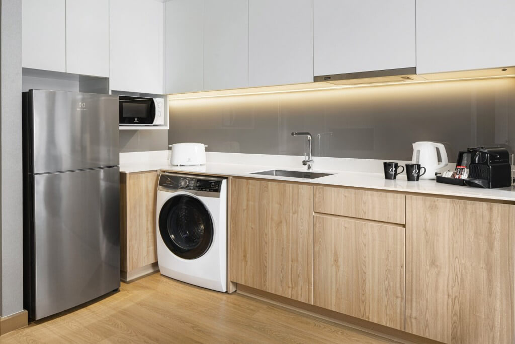 Oakwood Suites Bangkok washing machine inside the room
