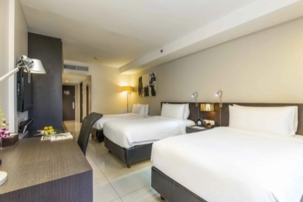 Maitria Hotel Sukhumvit 18 triple room with three single beds perfect for group travel