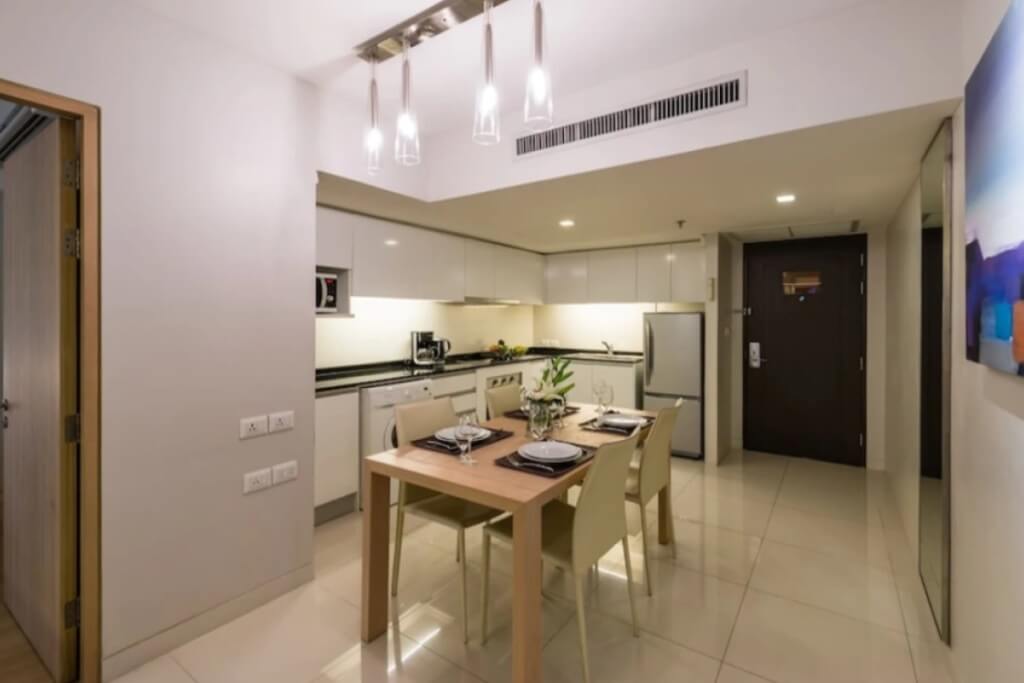 Maitria Hotel Sukhumvit 18 room with kitchenette and dining table for convenient stay