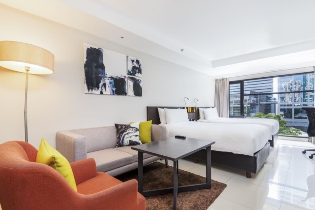 Maitria Hotel Sukhumvit 18 room with large floor-to-ceiling window and excellent natural lighting