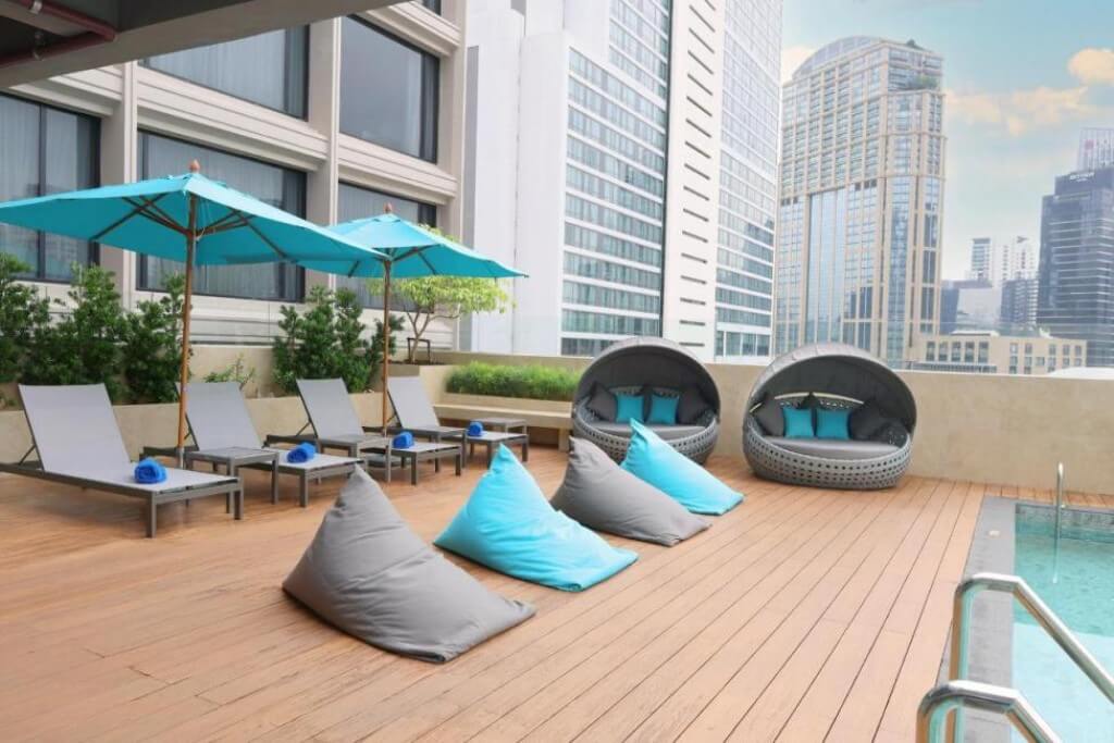 Pool lounge chairs at Four Points by Sheraton Bangkok Sukhumvit 22 with relaxing atmosphere