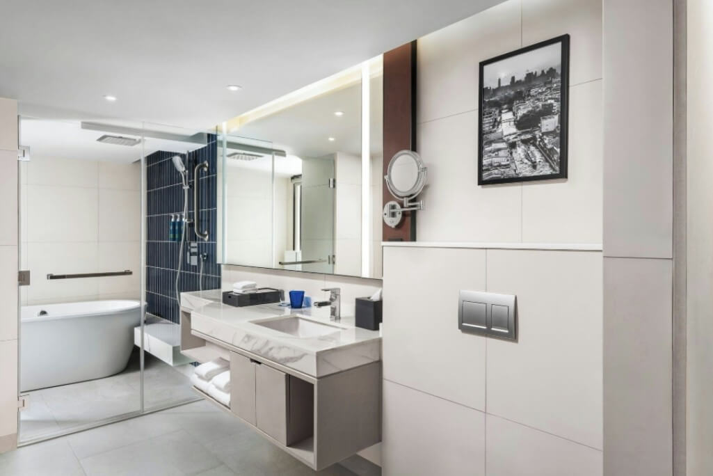 Walk-in shower and separate bathtub at Four Points by Sheraton Bangkok Sukhumvit 22 bathroom