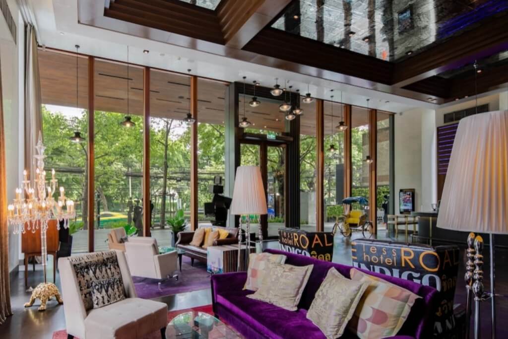 Hotel Indigo Bangkok Wireless Road lobby seating area with retro sofa and industrial style