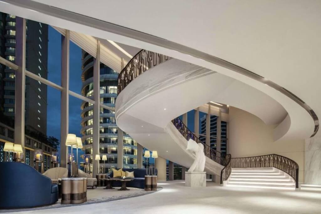 Grand spiral staircase in the lobby of Waldorf Astoria Bangkok hotel