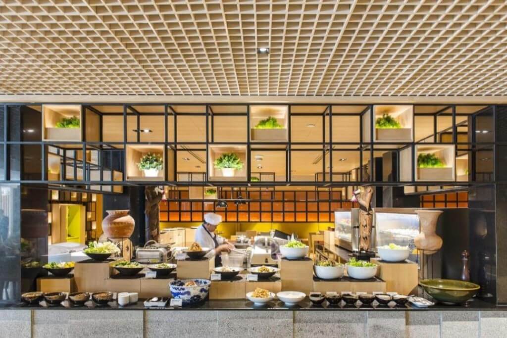 Holiday Inn Bangkok breakfast buffet food station with variety of dishes