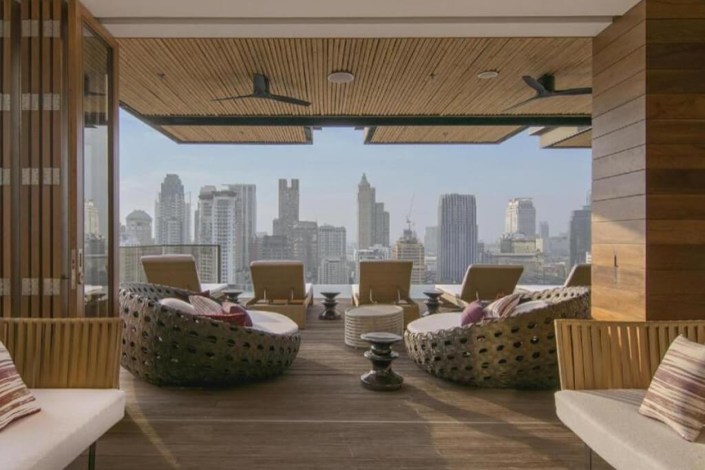 Hotel Indigo Bangkok Wireless Road pool deck lounge chairs with relaxing resort atmosphere