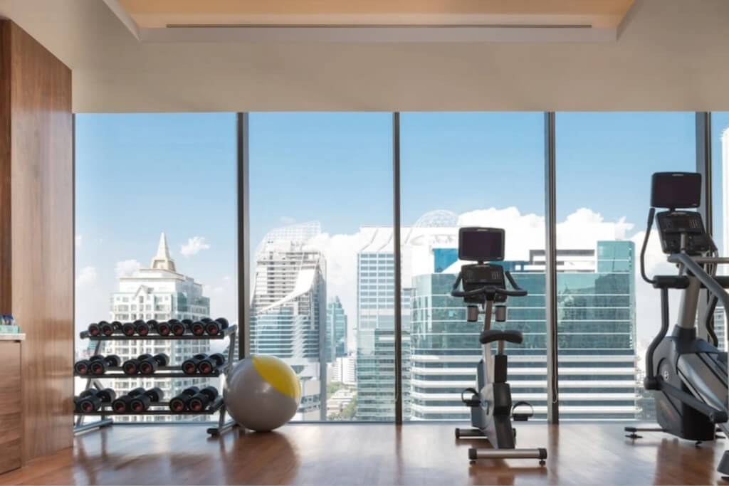 Hotel Indigo Bangkok Wireless Road high floor gym with large windows and city view
