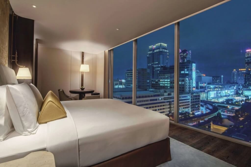 Beautiful Bangkok city night view from large window of Waldorf Astoria Bangkok room