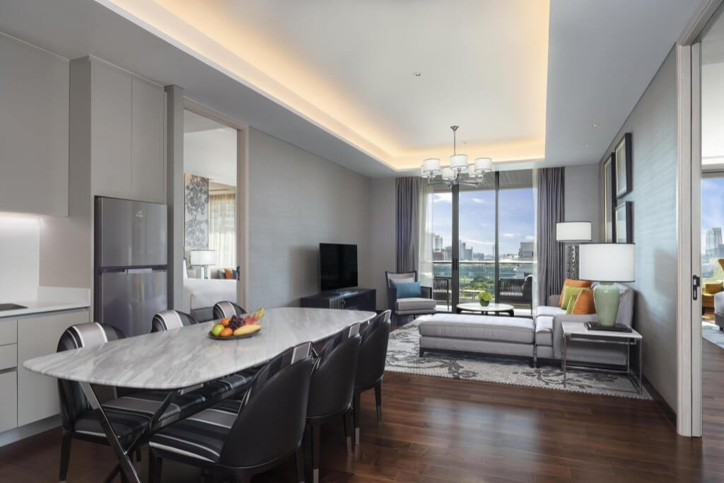 Spacious suite with full kitchen dining table and separate living room at Sindhorn Kempinski Hotel Bangkok