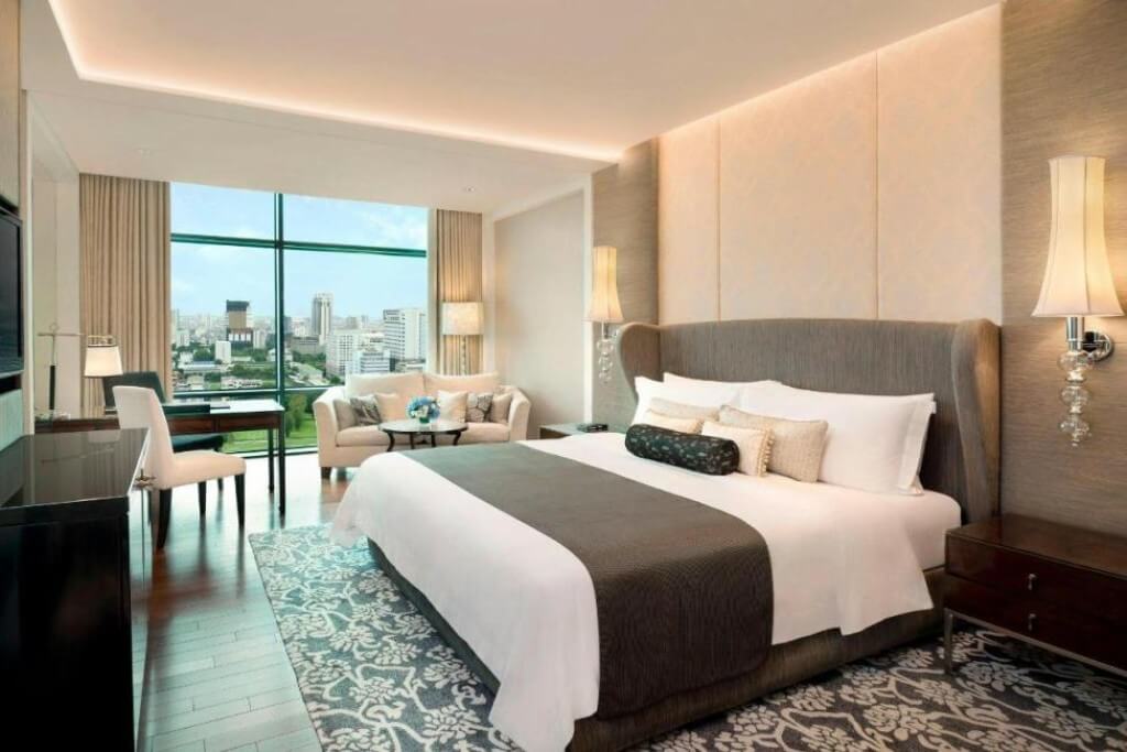 clean and minimalist bedroom design at The St. Regis Bangkok with comfortable bedding