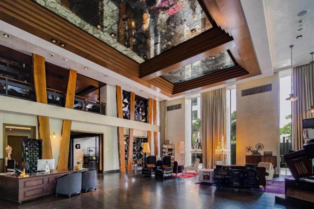 Hotel Indigo Bangkok Wireless Road lobby with high ceiling and large bright windows