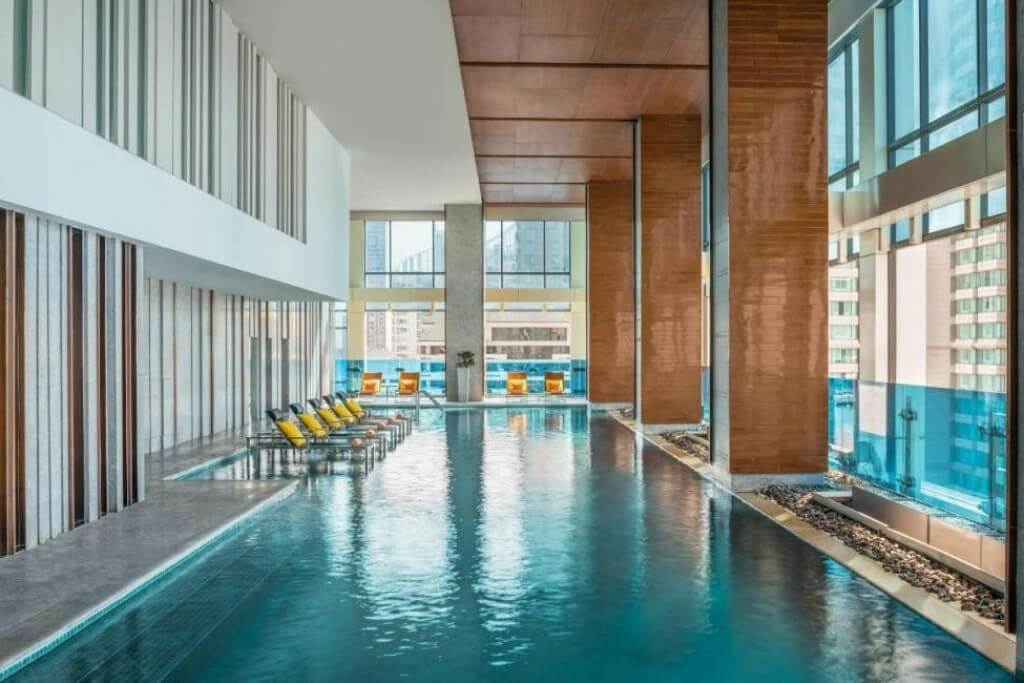 Semi-outdoor swimming pool at Renaissance Bangkok Ratchaprasong Hotel with comfortable temperature