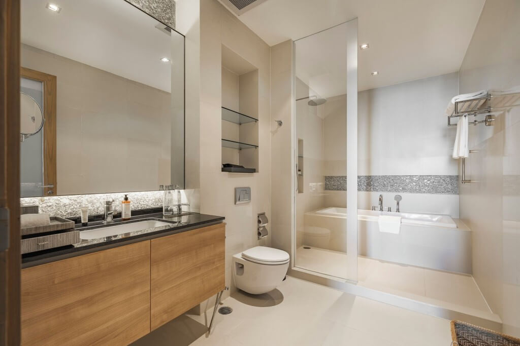 Warm color bathroom design at MUU Bangkok Hotel