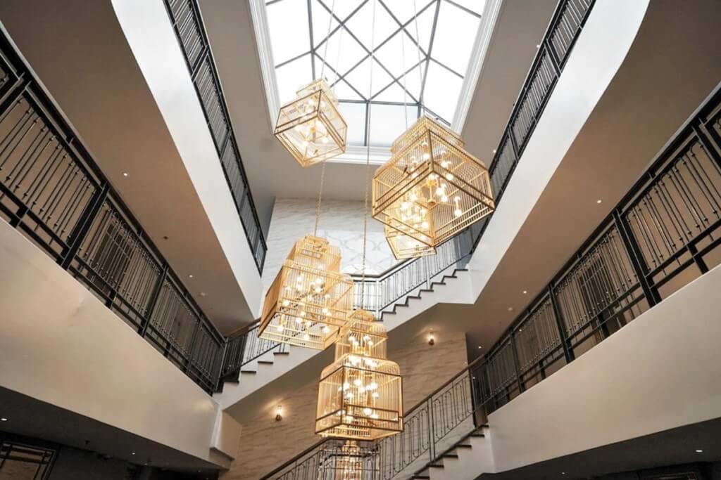 The Salil Hotel Sukhumvit 57 interior staircase and vintage lighting resembling Hogwarts castle