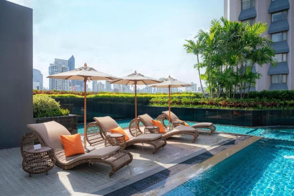 Comfortable pool lounge chairs at Hotel Nikko Bangkok perfect for evening relaxation