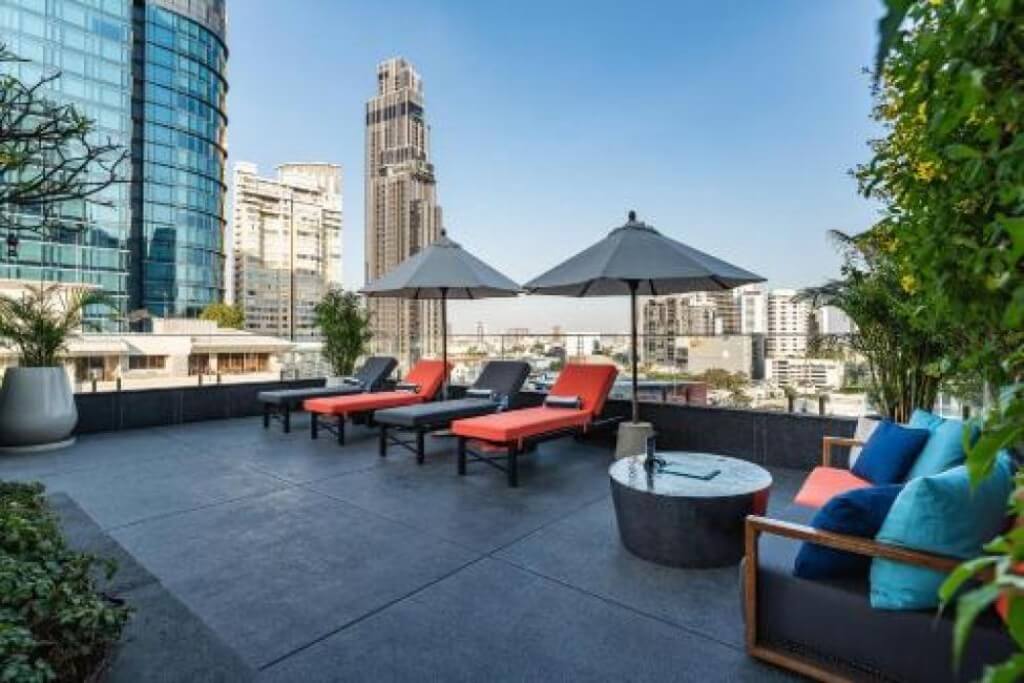 Pool lounge chairs at MUU Bangkok Hotel for relaxing