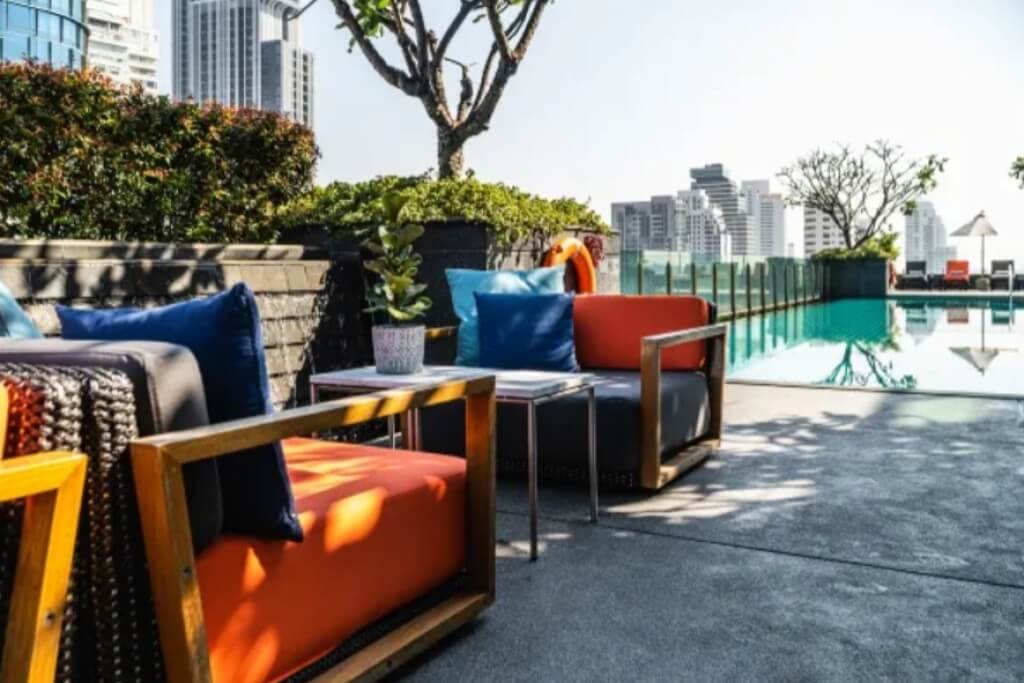 Poolside sofa area at MUU Bangkok Hotel with relaxing vibe
