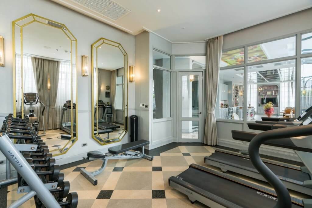 The Salil Hotel Sukhumvit 57 small gym with treadmill dumbbells elliptical and strength equipment