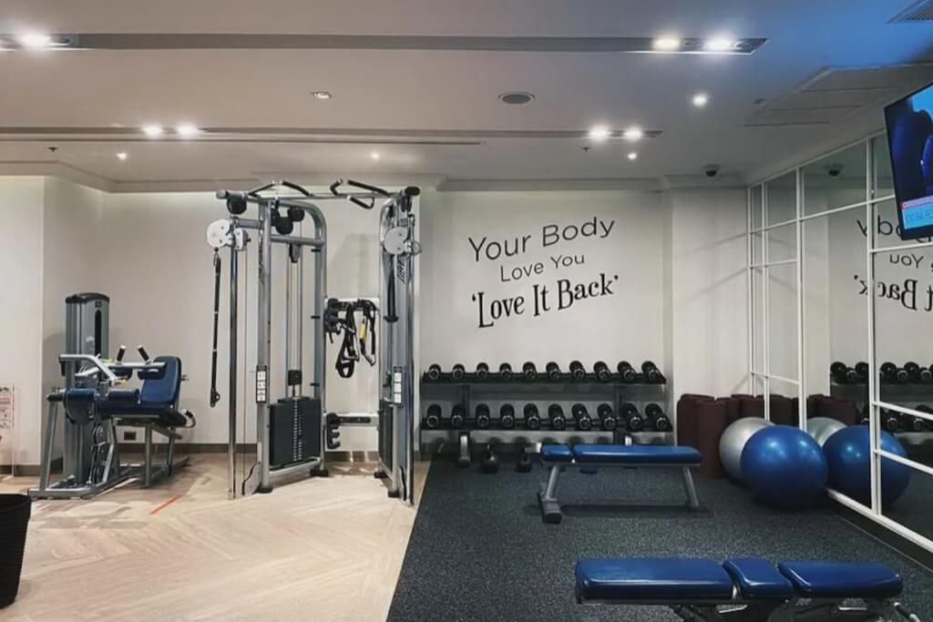 Diverse gym equipment and weight training gear at MUU Bangkok Hotel