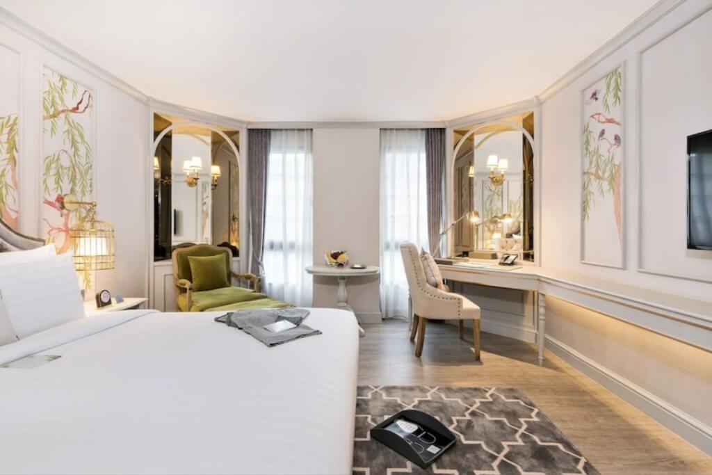 The Salil Hotel Sukhumvit 57 room with birdcage chandelier owl pillow and magical decor